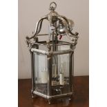 A silver plated hexagonal lantern, in 18th century manner having bevelled glass to all sides,