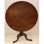 A 19th century snap top table, mahogany, turned stem, tri-partite base, 91cm diameter.