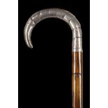 A PARTRIDGE WOOD AND SILVER CROOK HANDLED WALKING CANE. The handle simulates stepped partridge