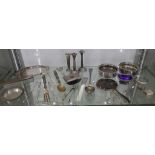 A mixed collection of silver and silver plated items to include a pair of candlesticks, a small 8