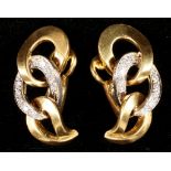 A heavy pair of 18 carat yellow and white gold and diamond clip earrings, having yellow gold links