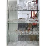 An assortment of glassware to include cut crystal tumblers, vases and celery vases, decanters,