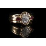 A French 18ct gold, diamond cluster and ruby set ring.