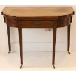 A George III mahogany card table, with shaped top and single drawer on square tapered legs and