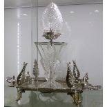 An elaborate white metal twin handled tray, with applied embellishments and serving as a base for