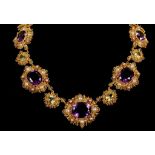 A late 19th / early 20th century yellow gold, amethyst, peridot, and pearl necklace, of