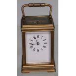 An early 20th century brass and 5 glass repeater carriage clock, with oversize top glass revealing