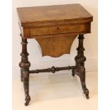 A good Victorian walnut and tunbridge inlaid games table, the fold over top with chequerboard,