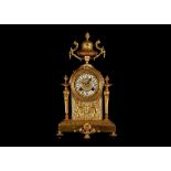 A LATE 19TH CENTURY FRENCH GILT METAL MANTEL CLOCK