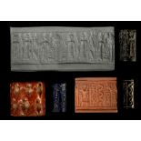 FOUR MESOPOTAMIAN HARDSTONE CYLINDER SEALS Circa 3300-1700 B.C. Including a Jemdet Nasr red stone