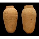 TWO EGYPTIAN 'NILE SILT WARE' JARS Late Period to Ptolemaic, circa 664-32 B.C. With elongated