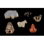 FIVE ANCIENT NEAR EASTERN HARDSTONE AMULETS Circa 3rd-1st Millennium B.C. Including a Jemdet Nasr