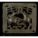 A CAUCASIAN BRONZE OPENWORK BELT BUCKLE Circa 6th-5th Century B.C. Depicting a stag with branched