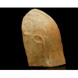 AN EGYPTIAN TERRACOTTA ANTHOPOMORPHIC SARCOPHAGUS LID FRAGMENT New Kingdom, Ramesside Period,