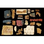 A COLLECTION OF COPTIC AND ISLAMIC TEXTILE FRAGMENTS AND FOUR EGYPTIAN MINIATURE SHABTIS Circa