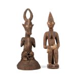 TWO AFRICAN FIGURES Including a Yoruba female figure with child, Nigeria, 67cm high; and a head