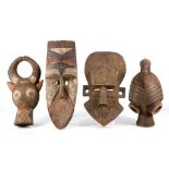 FOUR AFRICAN MASKS Including a Nunuma mask, Burkina Faso, two masks from Cameroon and another from