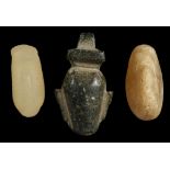 THREE ANCIENT HARDSTONE AMULETS Circa 2nd-1st Millennium B.C. Including an Egyptian steatite heart