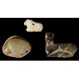 THREE MESOPOTAMIAN HARDSTONE AMULETS Jemdet Nasr, circa 3300-2900 B.C. Including a banded calcite