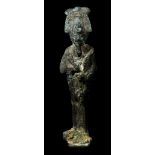 A SMALL EGYPTIAN BRONZE FIGURE OF OSIRIS Late Period, circa 664-332 B.C. Holding the crook and the