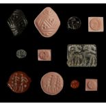 SIX ANCIENT NEAR EASTERN HARDSTONE SEALS Circa 3rd Millennium B.C. to 5th Century A.D. Including a