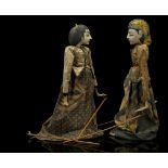TWO WAYANG GOLEK PUPPETS, INDONESIA With articulated head and arms connected to rods, with batik