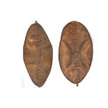 TWO MASAI HIDE SHIELDS, KENYA With traditional painted decoration, 120cm and 134cm high (2)