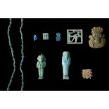 A GROUP OF EGYPTIAN GLAZED COMPOSITION AMULETS AND SHABTIS New Kingdom to Late Period, circa 1550-