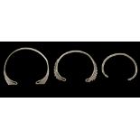 THREE LAHU HILL TRIBE SILVER NECK RINGS, THAILAND Solid-cast, two examples with flattened back-