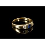 An 18 carat yellow gold, diamond, and sapphire 'gypsy' ring, pave set cushion cut sapphire and two