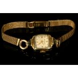 A ladies vintage 14k gold cased Wittnauer dress watch with later 18ct gold bracelet.