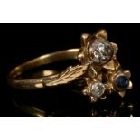 An 18ct gold, diamond and sapphire set floral cluster ring.