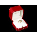 Cartier. An 18 carat rose, white, and yellow gold trilogy ring, together with original box and