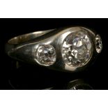 A gent's 18ct white gold and diamond rub-over set three stone ring. Central stone: approx 2ct+