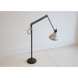 A 1950s HERBERT TERRY ANGLEPOISE FLOOR LAMP, with aluminium shade and black enamelled stem (145cm