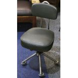 A 1920s INDUSTRIAL STEEL WORK CHAIR, with green rexine upholstery, with swivel and title