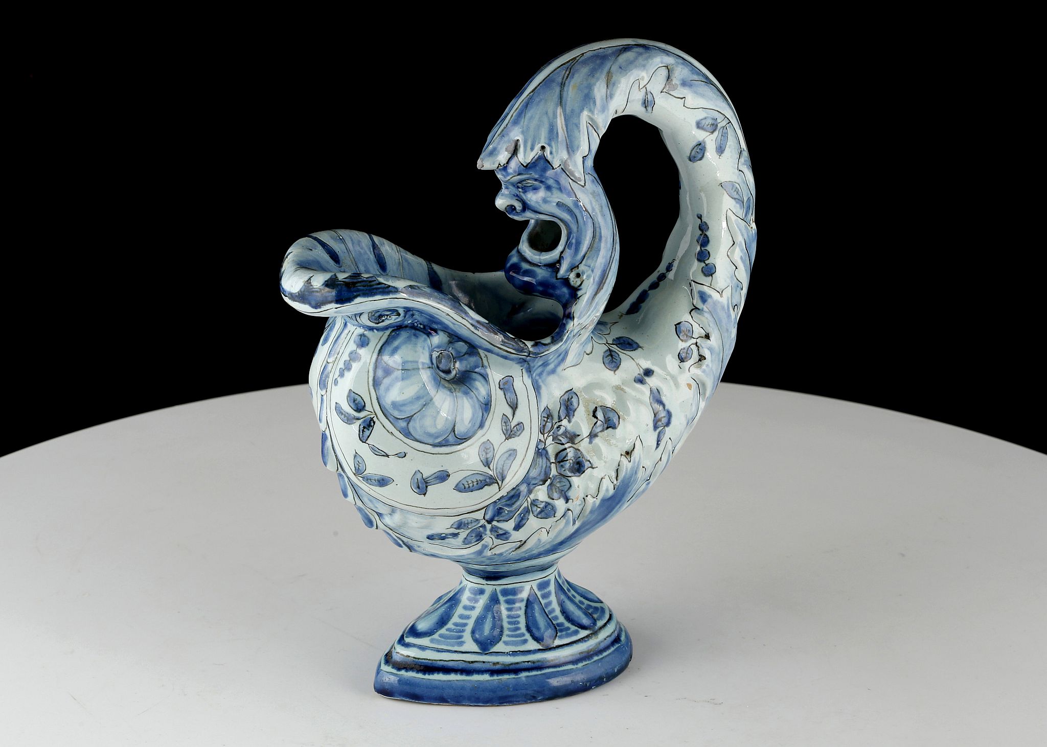 A BLUE AND WHITE ITALIAN MAIOLICA VASE, MANUFACTURED BY CANTAGALLI, CIRCA 1900, in the form of a