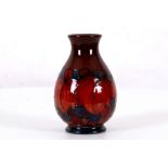 WILLIAM MOORCROFT 'LEAF AND GRAPE' FLAMBE VASE, CIRCA 1925-1934, with blue painted signature and