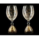 A PAIR OF LARGE SCALE CRYSTAL GLASS GOBLETS, circa 1970, etched and gilded with magic flute design