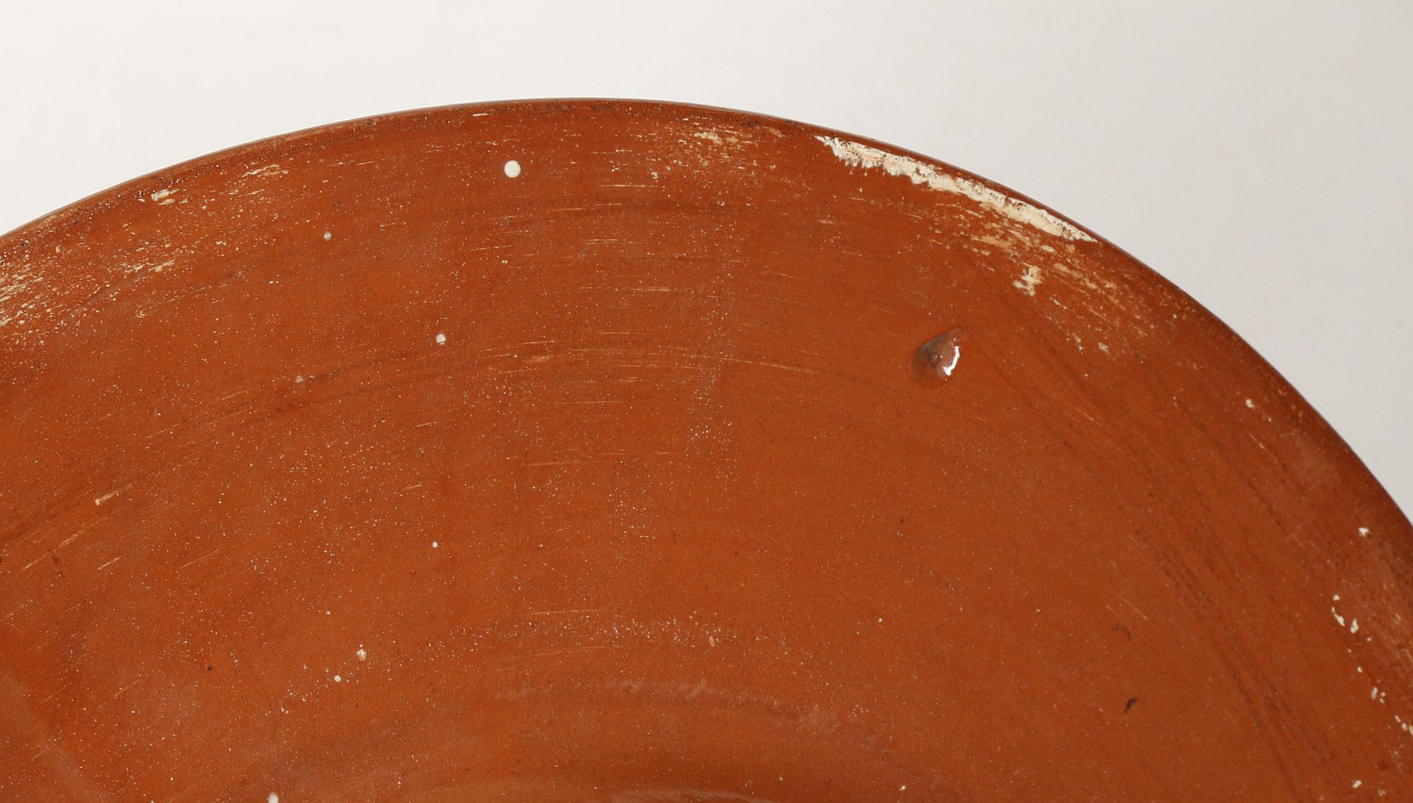 CARLO MANZONI, ITALY, a late 19th century pottery charger with incised slip border decoration, - Image 5 of 5