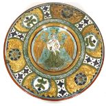 CARLO MANZONI, ITALY, a late 19th century pottery charger with incised slip border decoration,