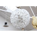 AN ITALIAN MURANO GLOBE FORM CHANDELIER, with clear glass dandelion form appliques, on chrome
