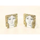 A PAIR OF PIERO FORNASETTI STEEL BOOKENDS, decorated with female with gold coins as hair (15cm x