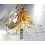 A MURANO CEILING PENDANT LIGHT, of single blown organic form, amber and clear glass (50cm wide).