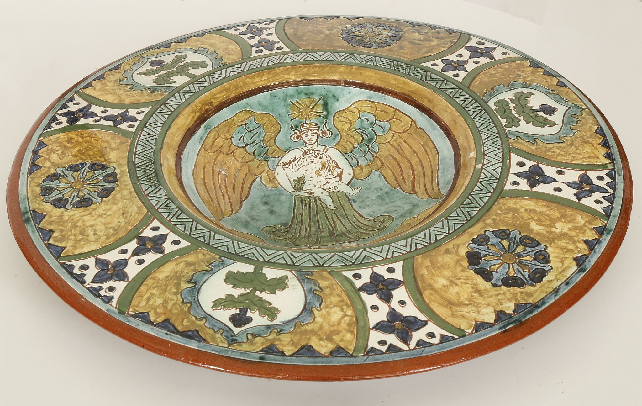 CARLO MANZONI, ITALY, a late 19th century pottery charger with incised slip border decoration, - Image 3 of 5
