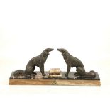 AN ART DECO BRONZE FIGURAL GROUP OF DOGS, on variegated marble base (base 46.5cm x 10cm).