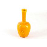 AN ARTS AND CRAFTS BURMANTOFT VASE, 1891-1904, bottle shape in yellow glaze, with incised motifs,