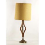 A 1950s AMERICAN TEAK AND BRASS STEM TABLE LAMP, with mustard shade (83cm high).