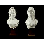 A PAIR OF ROYAL WORCESTER BLANC DE CHINE FEMALE PORCELAIN BUSTS, titled 'Night and Day', by Arnold