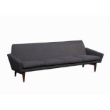 A DANISH 1960'S FOUR SEATER SOFA, with recent grey fabric upholstery, on teak legs.